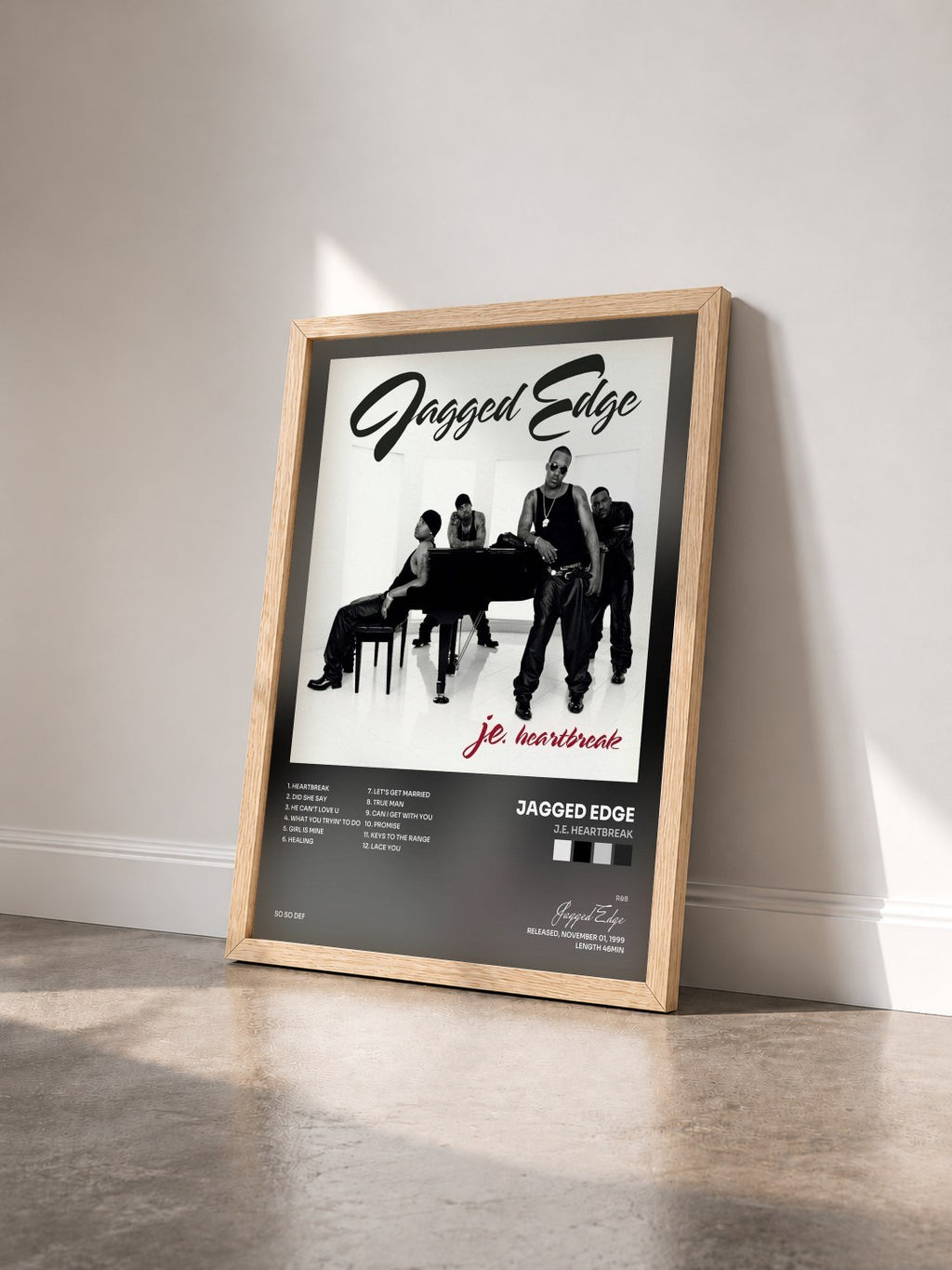 #bois Tableau de l'album J.E. Heartbreak de Jagged Edge vu de trois quarts, cadre en bois brut