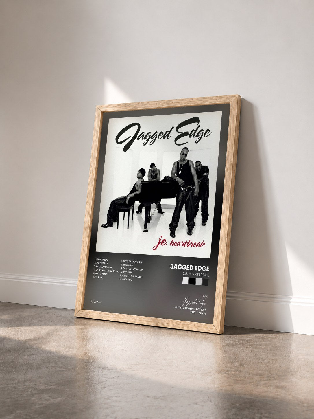 #bois Tableau de l'album J.E. Heartbreak de Jagged Edge vu de trois quarts, cadre en bois brut