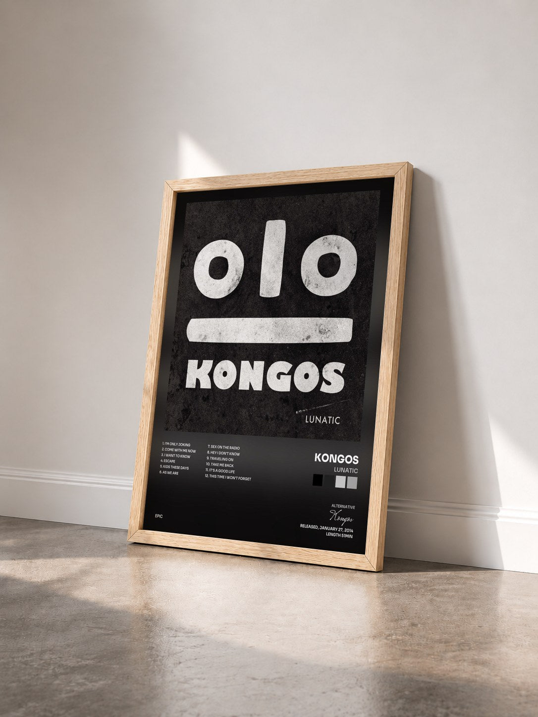 #bois Tableau de l'album Lunatic de Kongos vu de trois quarts, cadre en bois brut