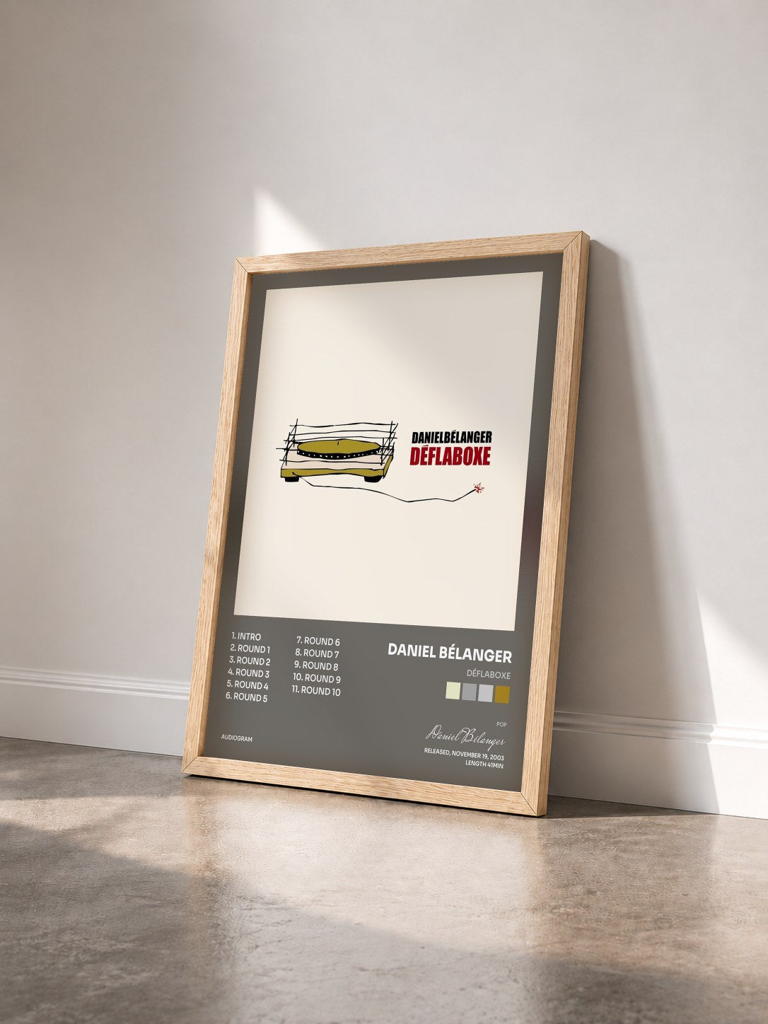#bois Tableau de l'album Déflaboxe de Daniel Bélanger vu de trois quarts, cadre en bois brut