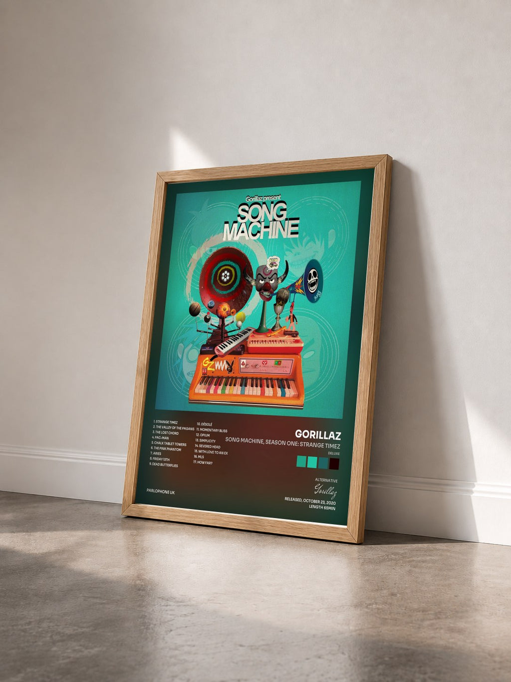 #bois Tableau de l'album Song Machine, Season One: Strange Timez (Deluxe) de Gorillaz vu de trois quarts, cadre en bois brut
