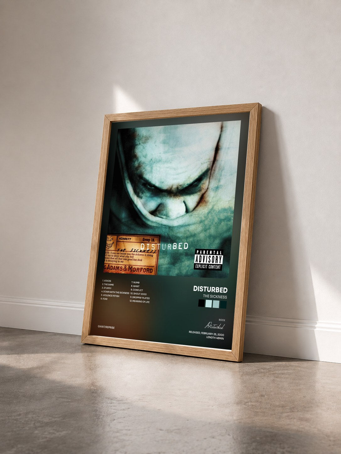 #bois Tableau de l'album The Sickness de Disturbed vu de trois quarts, cadre en bois brut