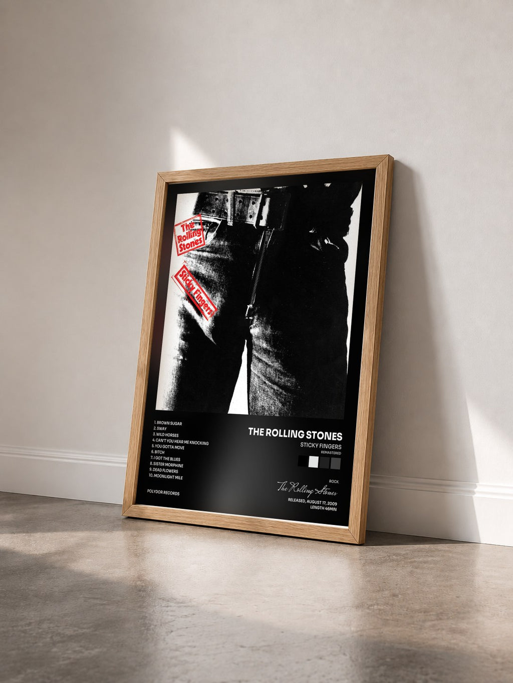 #bois Tableau de l'album Sticky Fingers (Remastered) de The Rolling Stones vu de trois quarts, cadre en bois brut