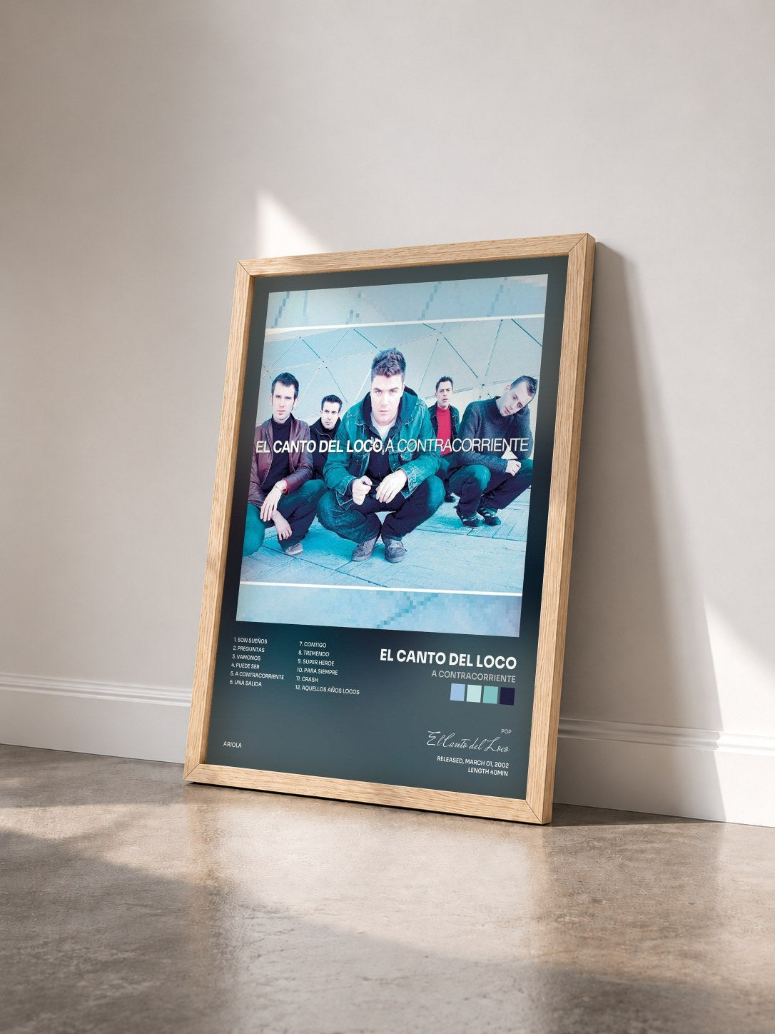 #bois Tableau de l'album A Contracorriente de El Canto del Loco vu de trois quarts, cadre en bois brut