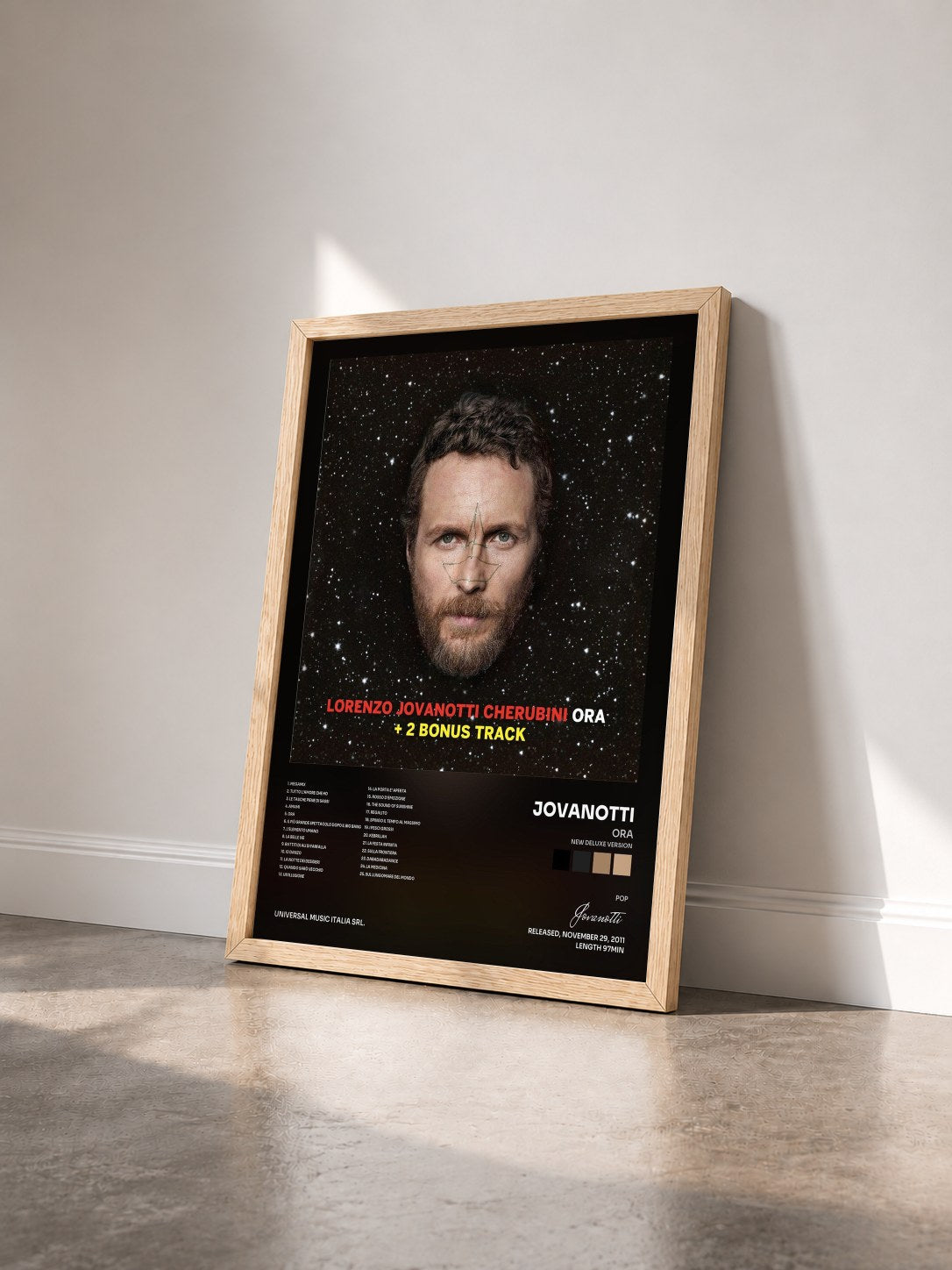 #bois Tableau de l'album Ora (New Deluxe Version) de Jovanotti vu de trois quarts, cadre en bois brut