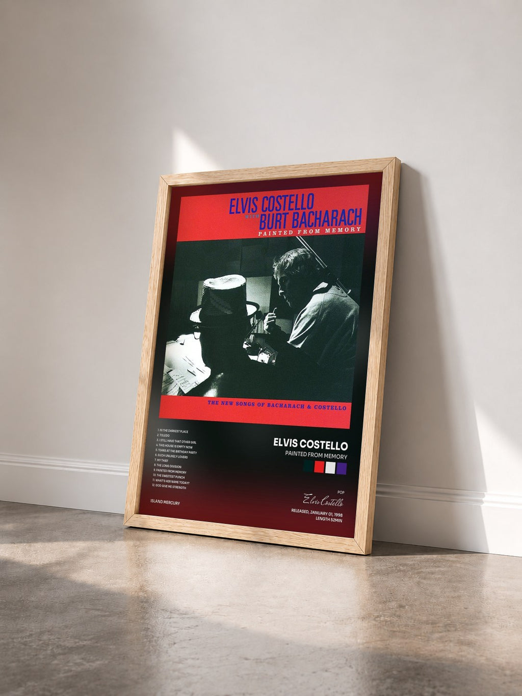 #bois Tableau de l'album Painted From Memory de Elvis Costello vu de trois quarts, cadre en bois brut