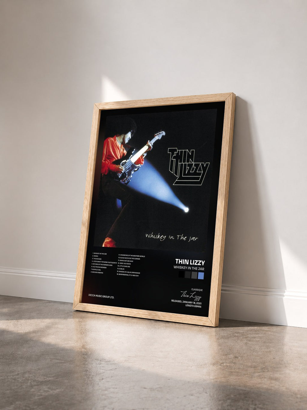 #bois Tableau de l'album Whiskey In The Jar de Thin Lizzy vu de trois quarts, cadre en bois brut