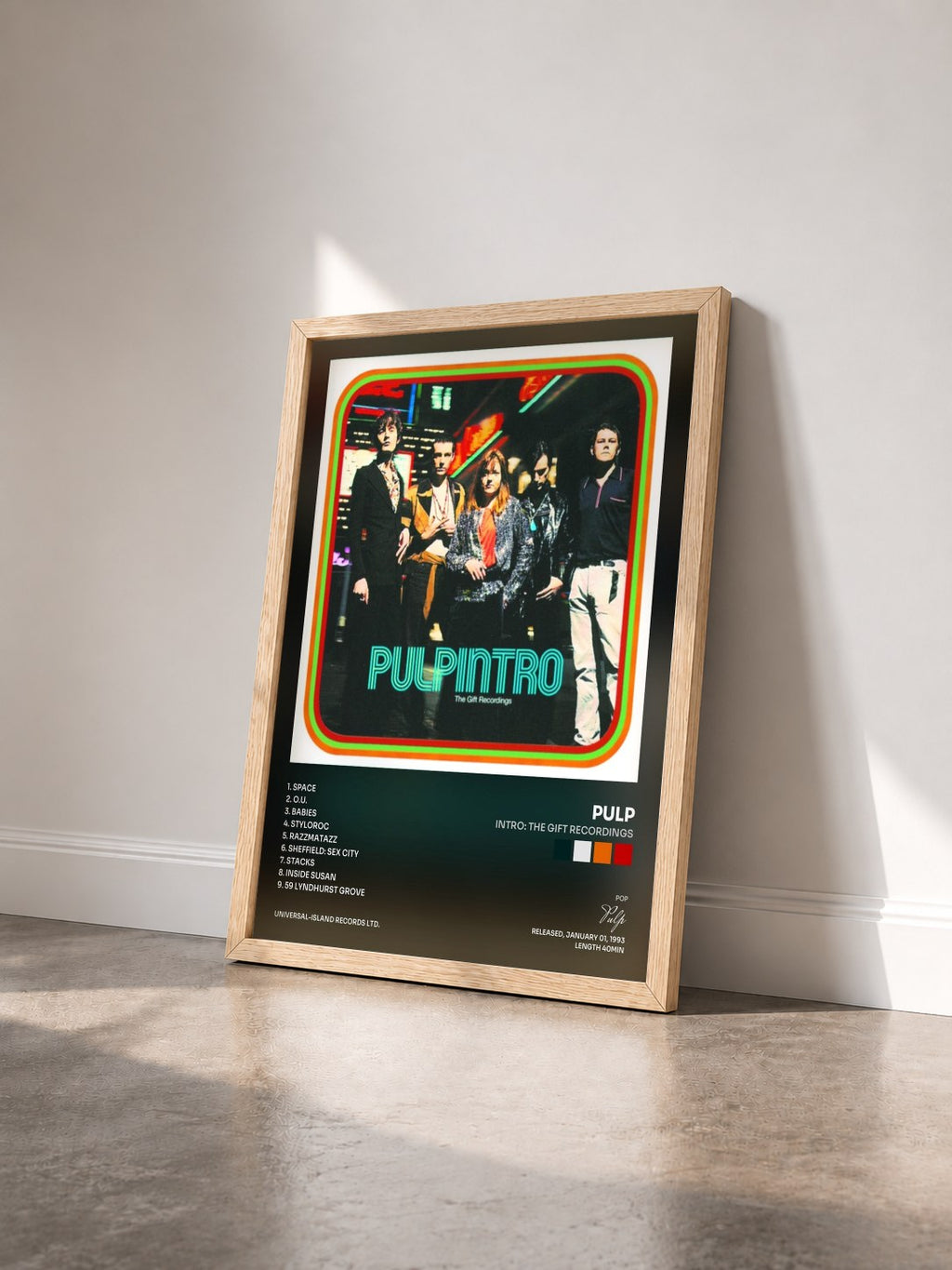 #bois Tableau de l'album Intro: The Gift Recordings de Pulp vu de trois quarts, cadre en bois brut