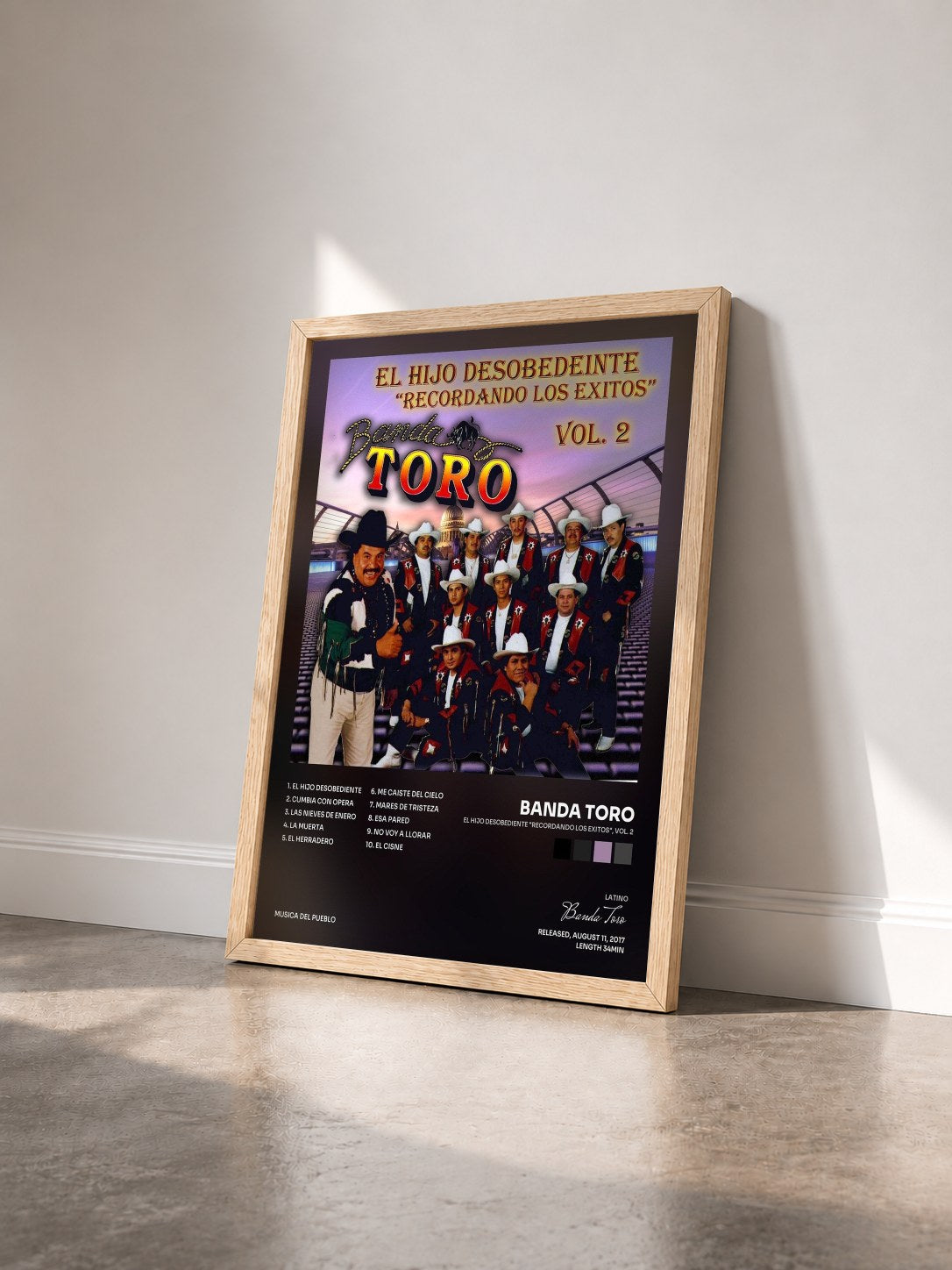 #bois Tableau de l'album El Hijo Desobediente "Recordando los Exitos", Vol. 2 de Banda Toro vu de trois quarts, cadre en bois brut