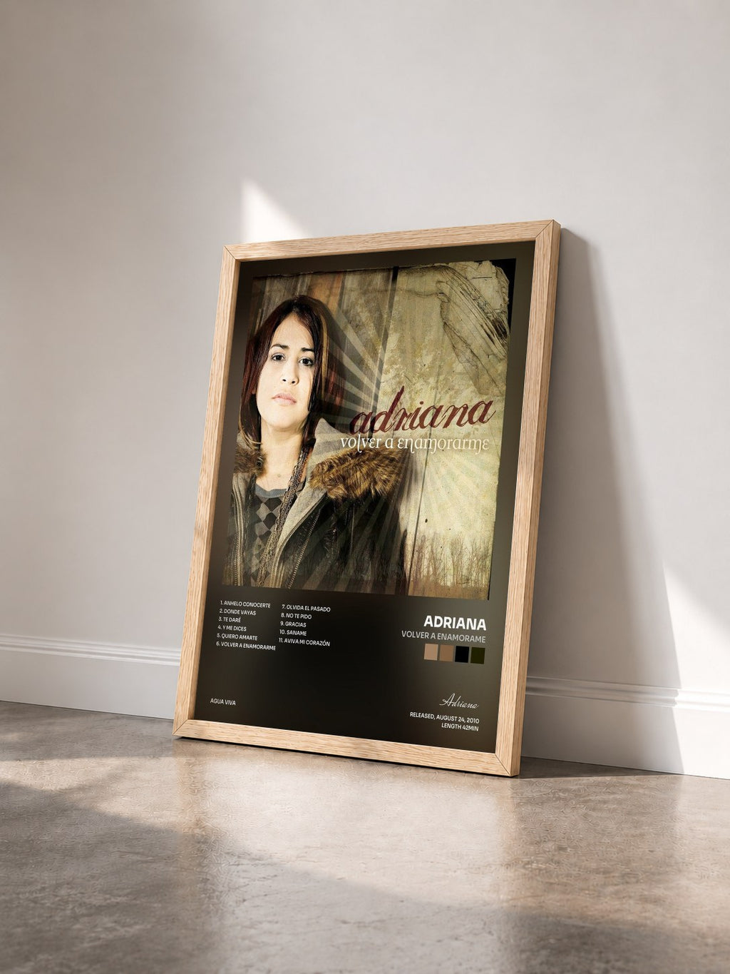 #bois Tableau de l'album Volver A Enamorame de Adriana vu de trois quarts, cadre en bois brut
