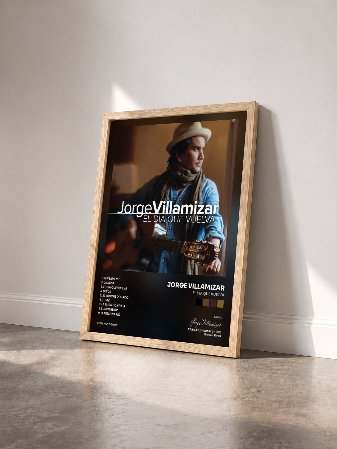 #bois Tableau de l'album El Día Que Vuelva de Jorge Villamizar vu de trois quarts, cadre en bois brut