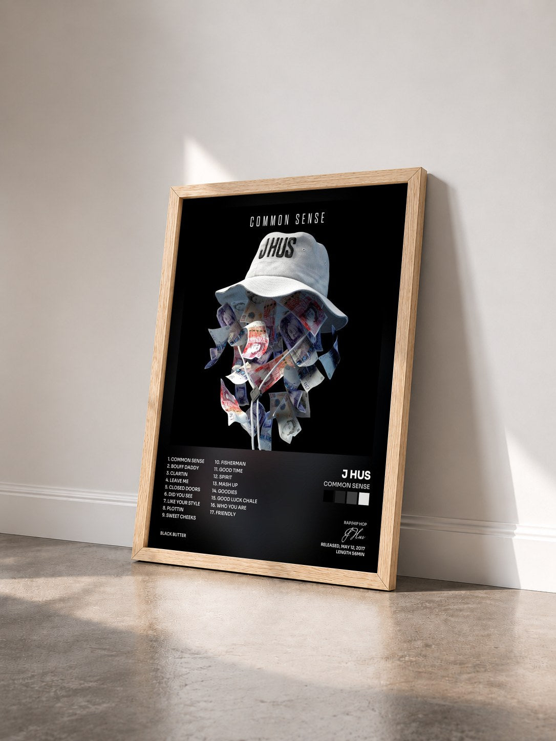 #bois Tableau de l'album Common Sense de J Hus vu de trois quarts, cadre en bois brut