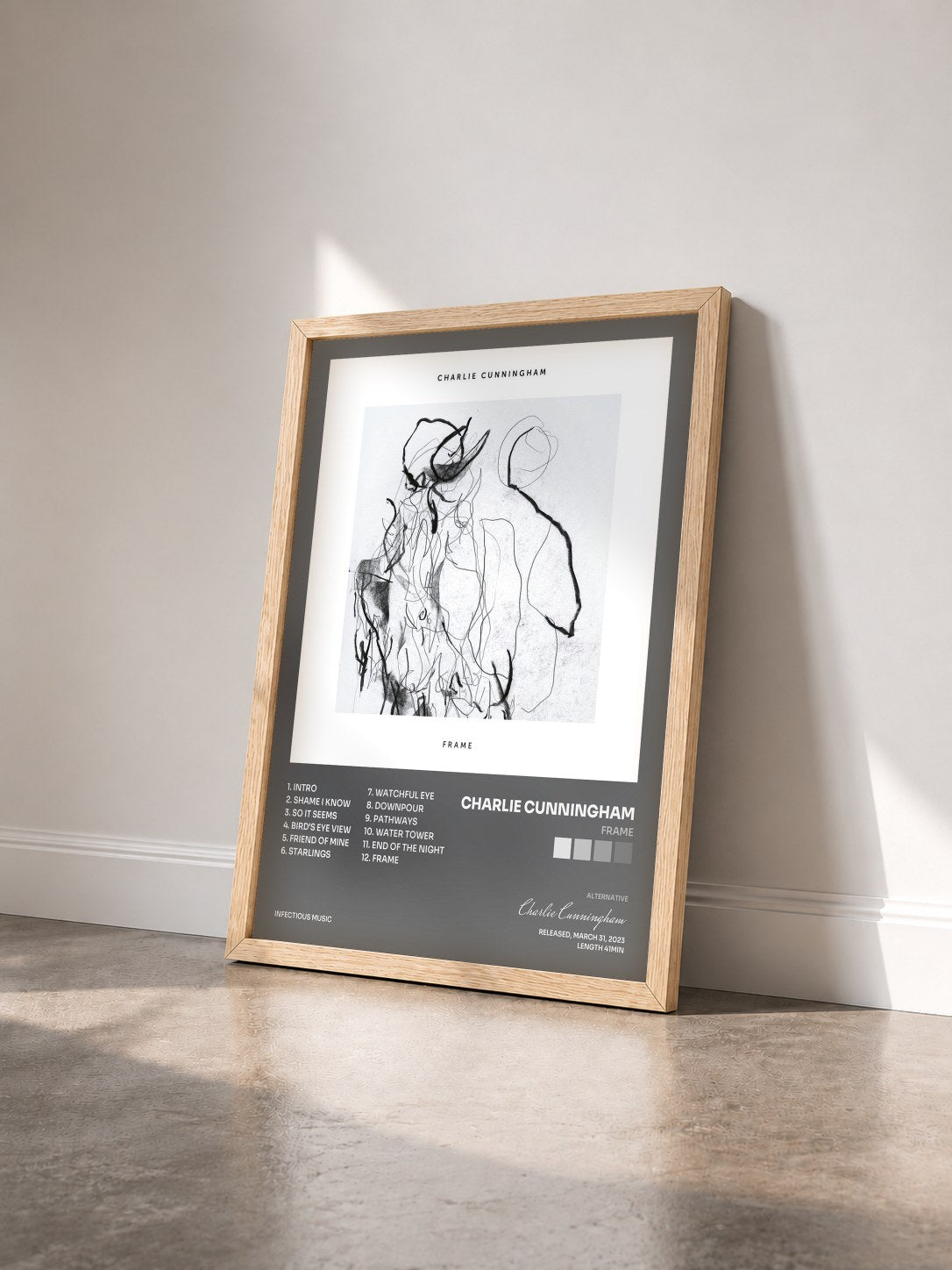 #bois Tableau de l'album Frame de Charlie Cunningham vu de trois quarts, cadre en bois brut
