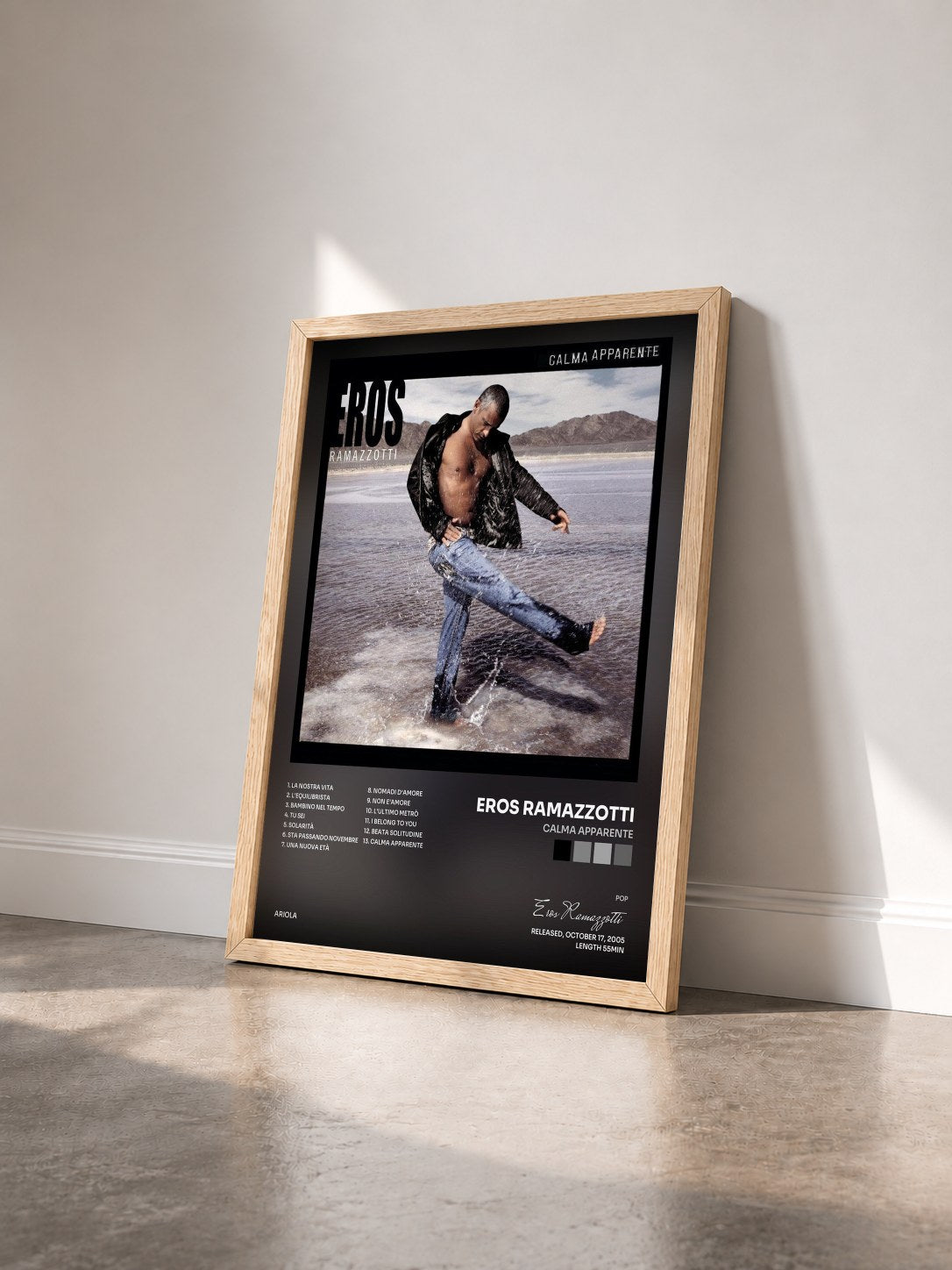 #bois Tableau de l'album Calma Apparente de Eros Ramazzotti vu de trois quarts, cadre en bois brut