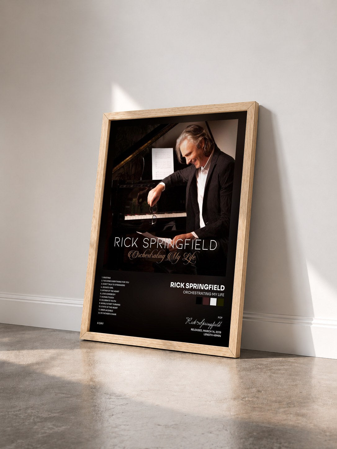 #bois Tableau de l'album Orchestrating My Life de Rick Springfield vu de trois quarts, cadre en bois brut