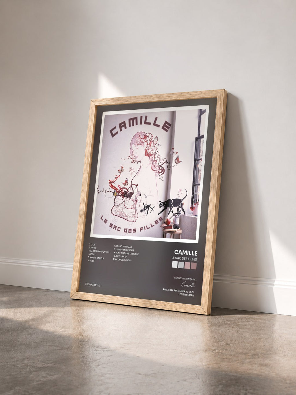 #bois Tableau de l'album Le sac des filles de Camille vu de trois quarts, cadre en bois brut