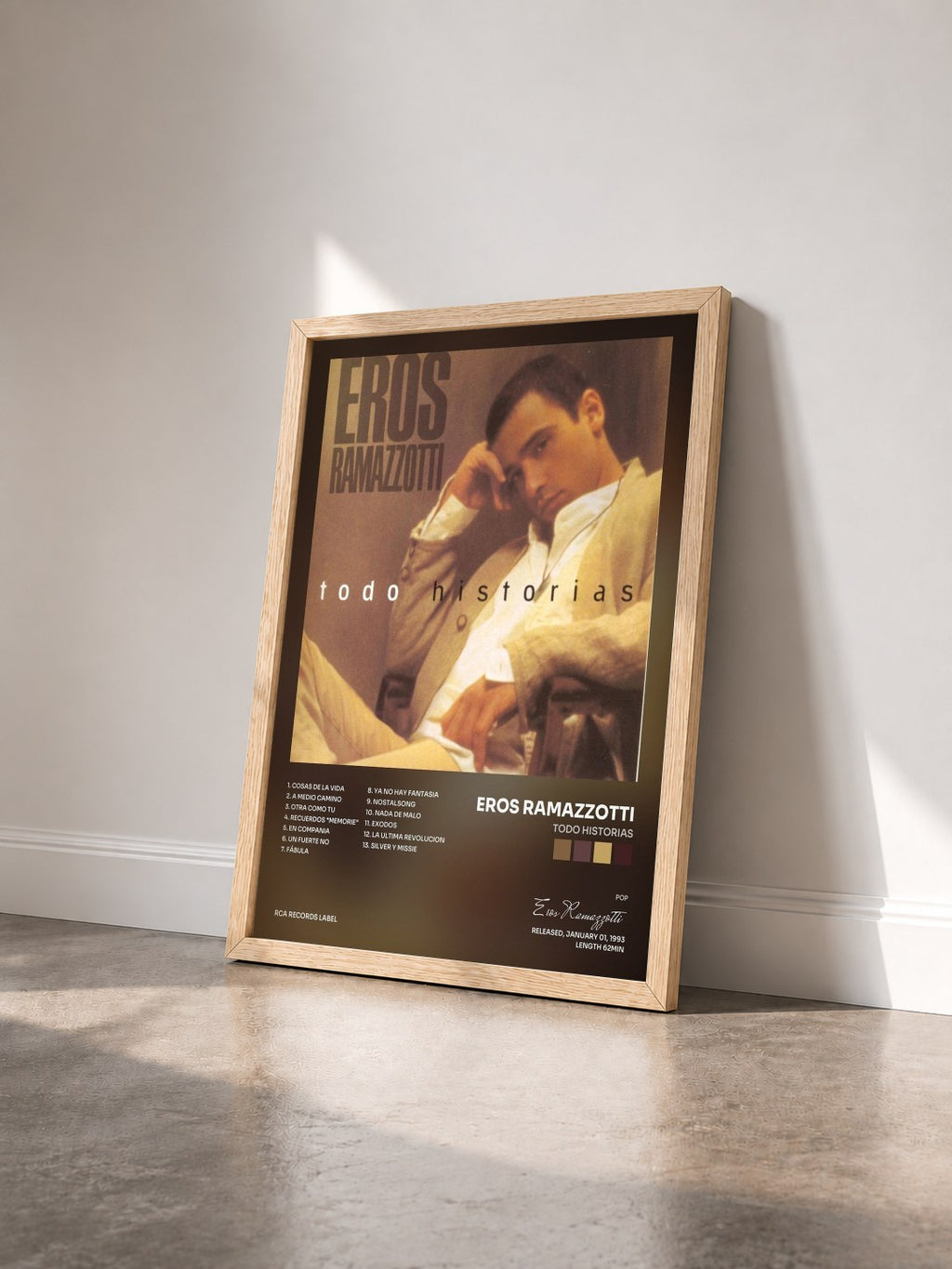 #bois Tableau de l'album Todo Historias de Eros Ramazzotti vu de trois quarts, cadre en bois brut