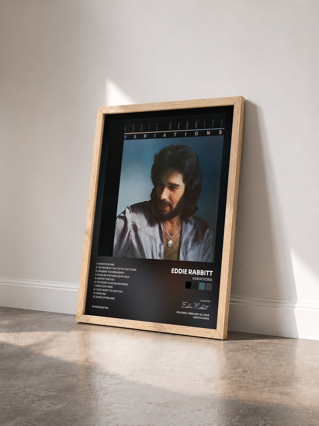 #bois Tableau de l'album Variations de Eddie Rabbitt vu de trois quarts, cadre en bois brut