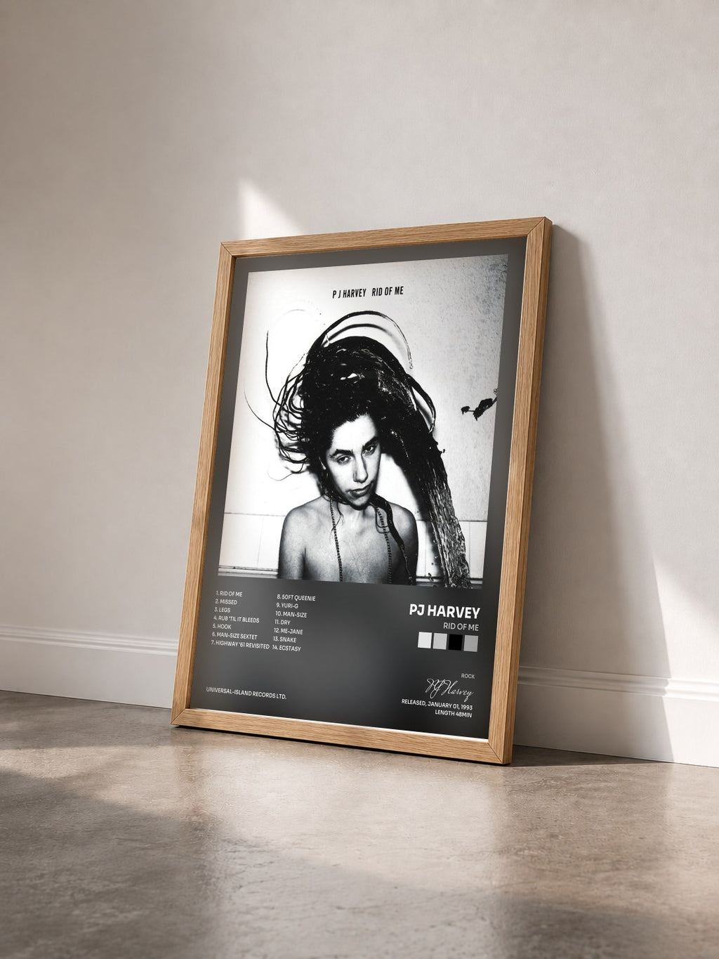 #bois Tableau de l'album Rid Of Me de PJ Harvey vu de trois quarts, cadre en bois brut