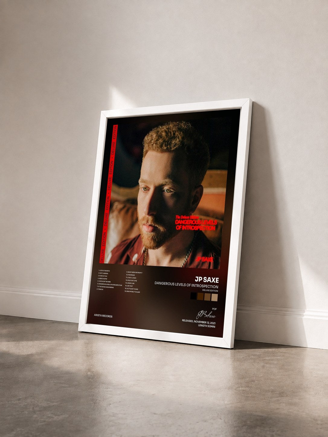 #blanc Tableau de l'album Dangerous Levels of Introspection (Deluxe Edition) de JP Saxe vu de trois quarts, cadre blanc