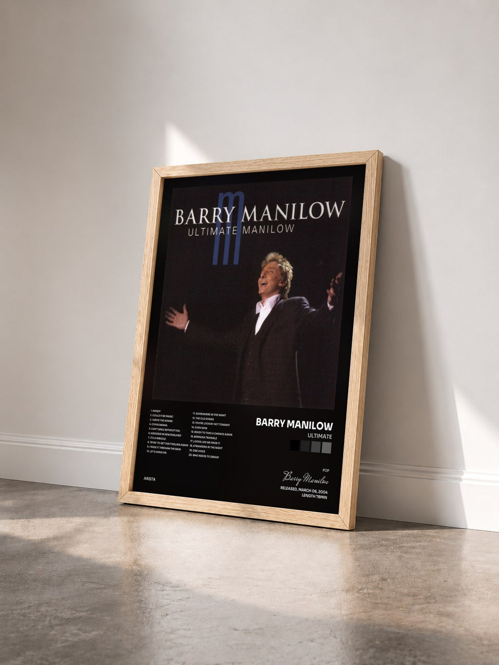 #bois Tableau de l'album Ultimate de Barry Manilow vu de trois quarts, cadre en bois brut