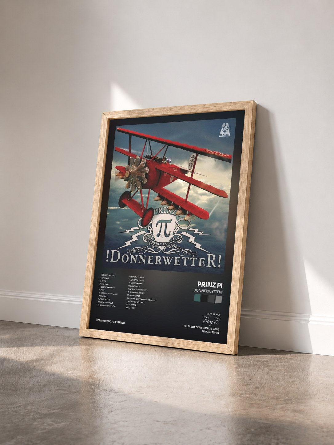 #bois Tableau de l'album Donnerwetter! de Prinz Pi vu de trois quarts, cadre en bois brut