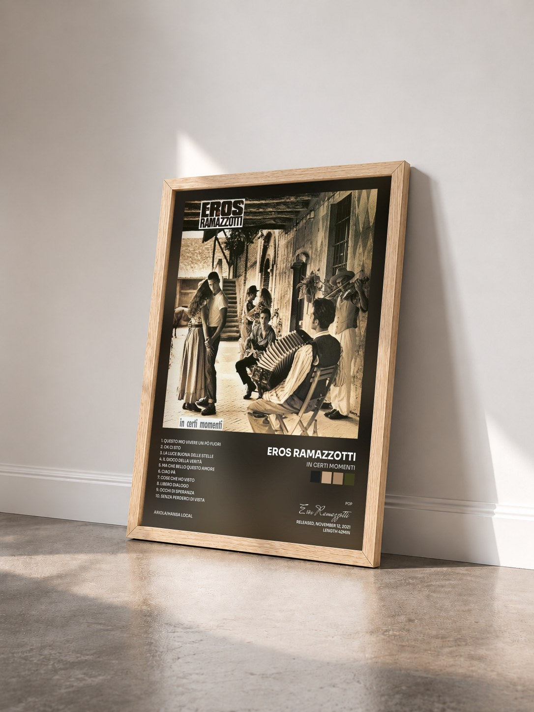#bois Tableau de l'album In certi momenti de Eros Ramazzotti vu de trois quarts, cadre en bois brut