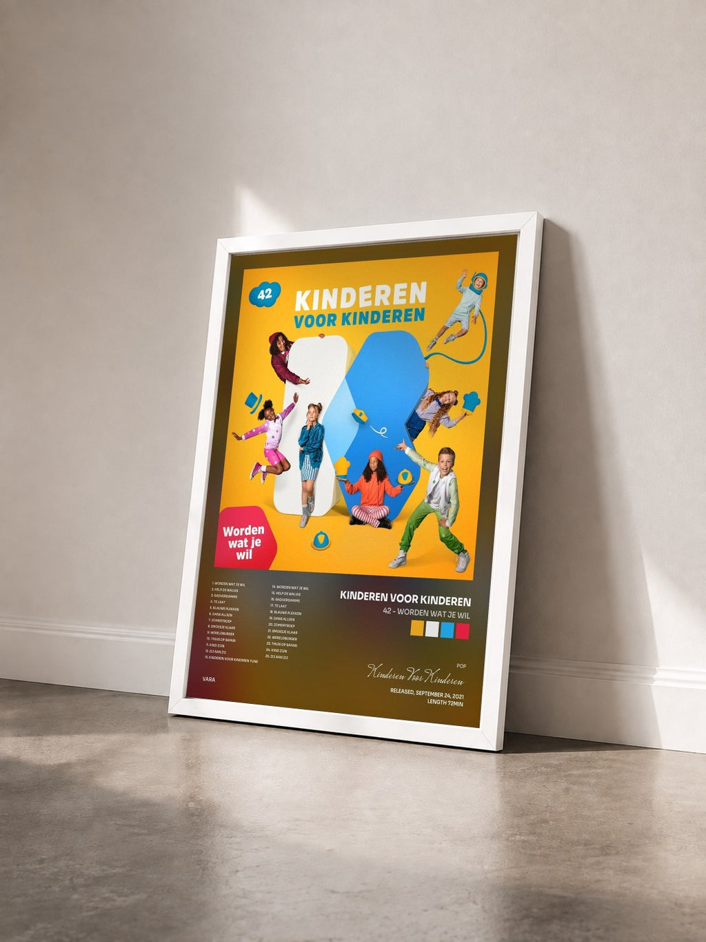 #blanc Tableau de l'album 42 - Worden wat je wil de Kinderen Voor Kinderen vu de trois quarts, cadre blanc