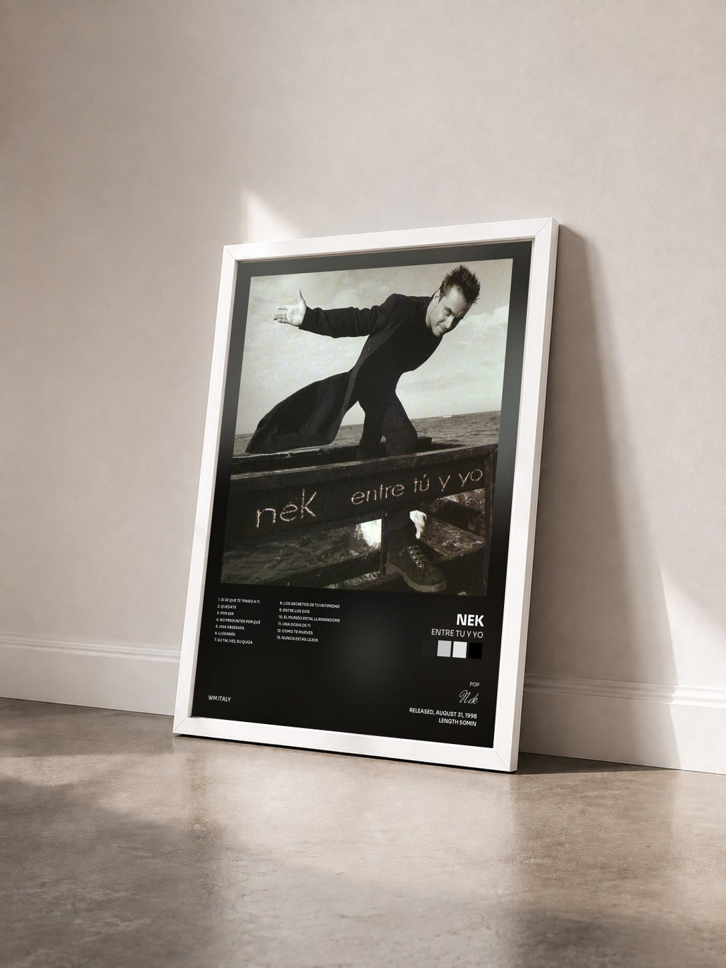#blanc Tableau de l'album Entre tu y yo de Nek vu de trois quarts, cadre blanc
