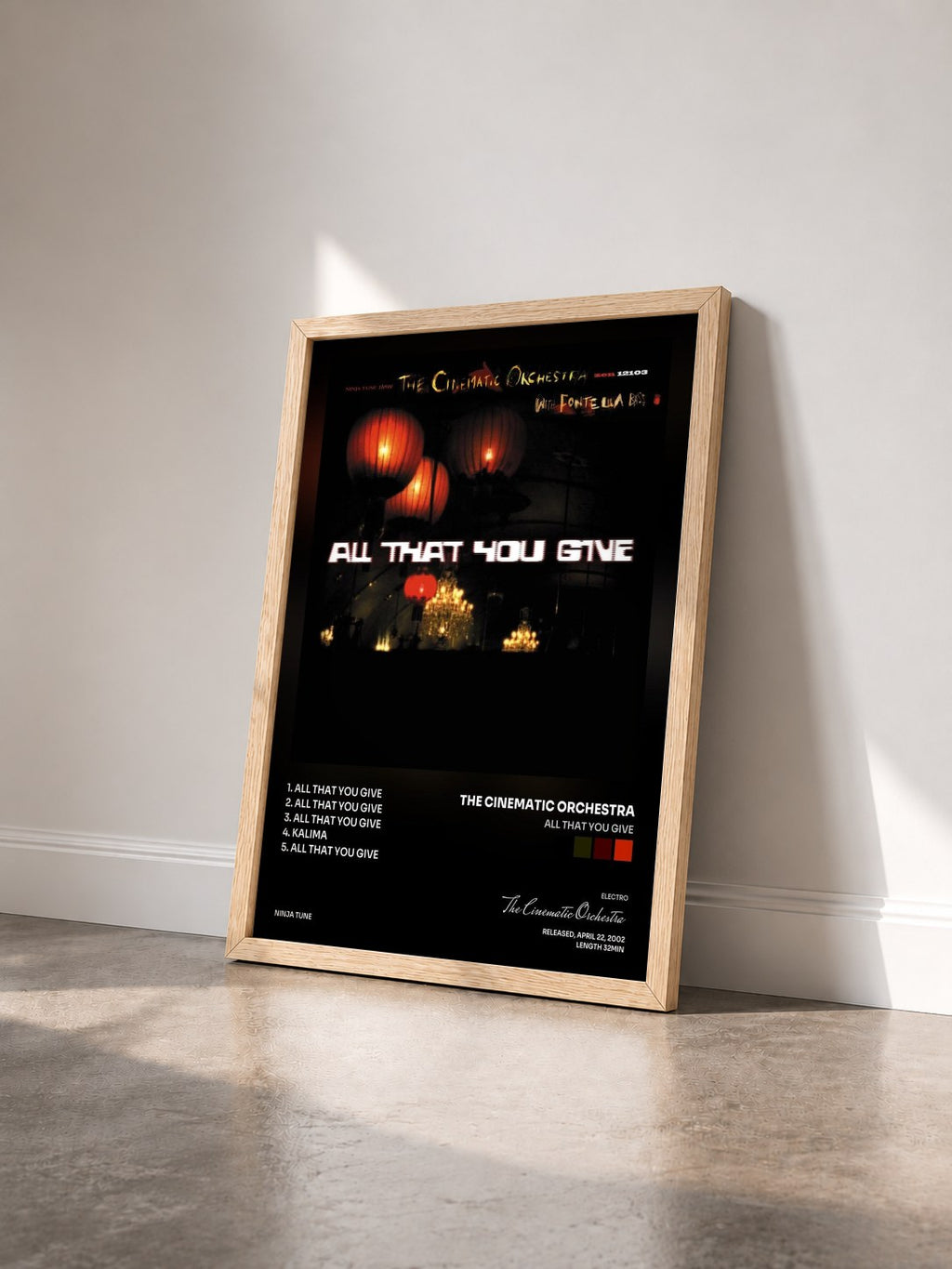 #bois Tableau de l'album All That You Give de The Cinematic Orchestra vu de trois quarts, cadre en bois brut