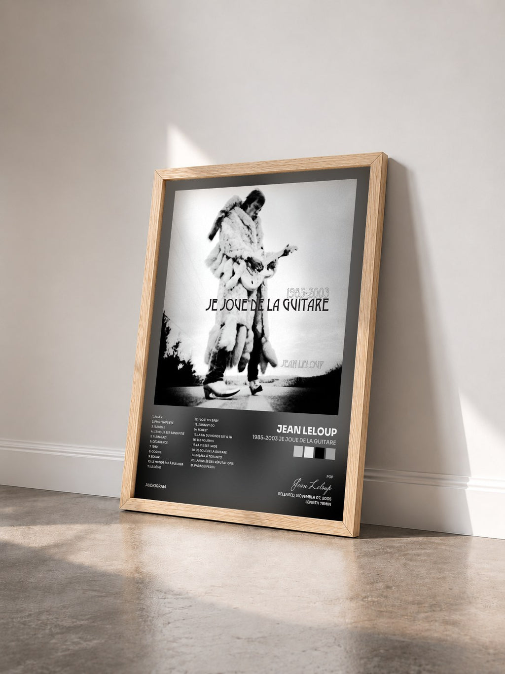 #bois Tableau de l'album 1985-2003 Je joue de la guitare de Jean Leloup vu de trois quarts, cadre en bois brut