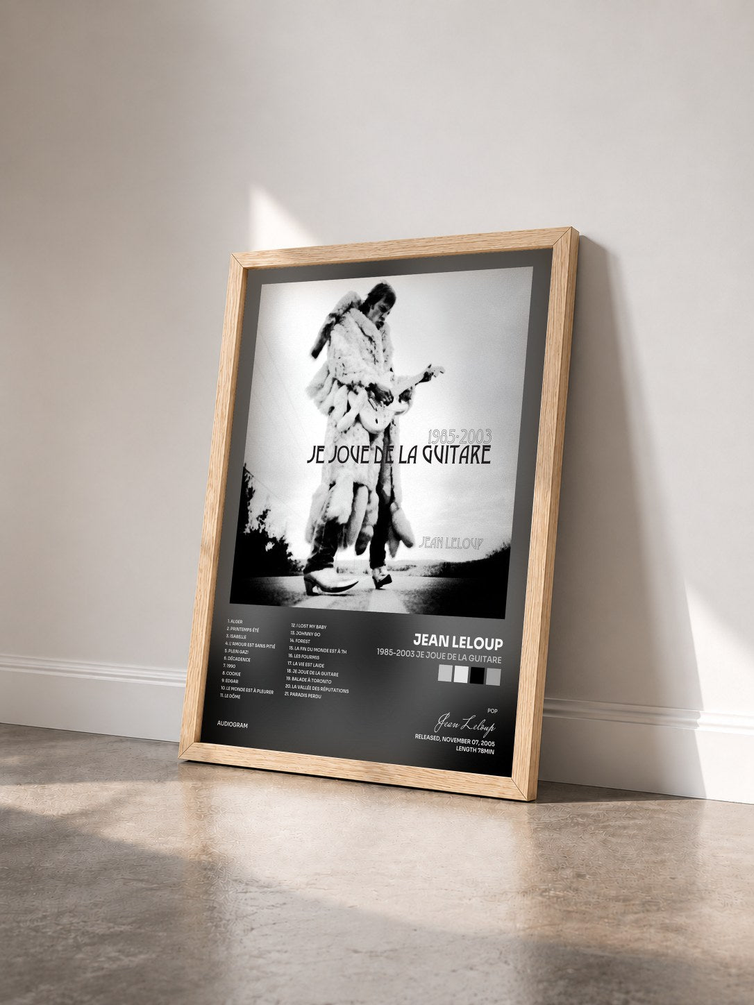 #bois Tableau de l'album 1985-2003 Je joue de la guitare de Jean Leloup vu de trois quarts, cadre en bois brut