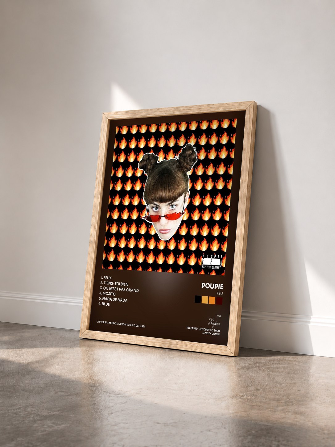 #bois Tableau de l'album FEU de Poupie vu de trois quarts, cadre en bois brut