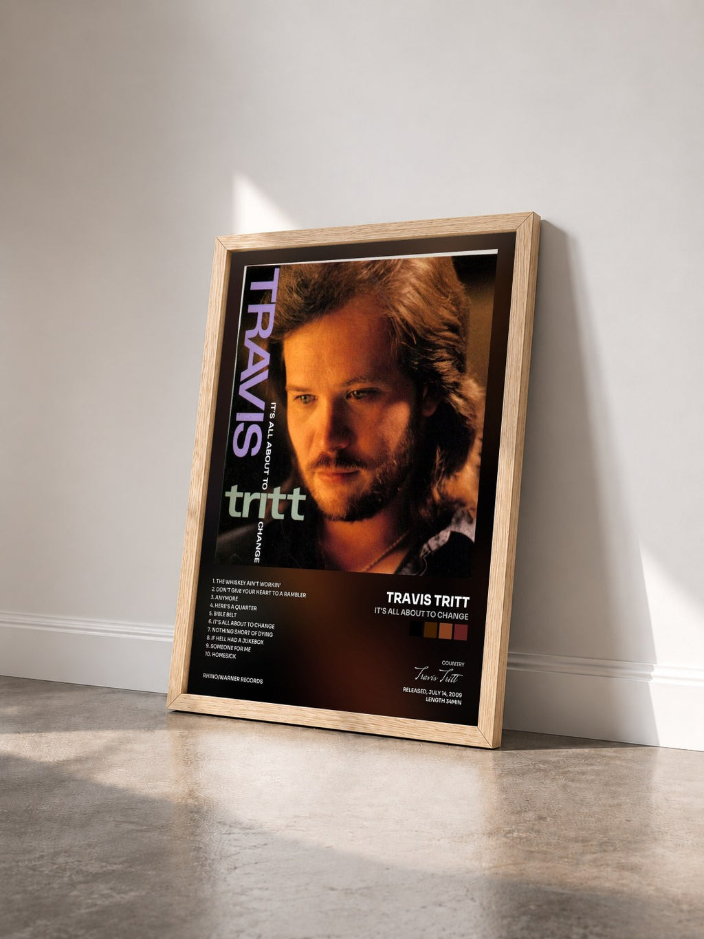 #bois Tableau de l'album It's All About to Change de Travis Tritt vu de trois quarts, cadre en bois brut
