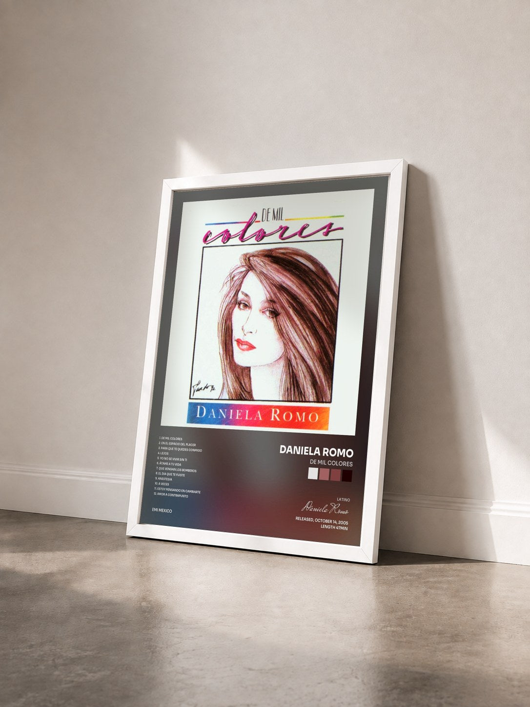 #blanc Tableau de l'album De Mil Colores de Daniela Romo vu de trois quarts, cadre blanc