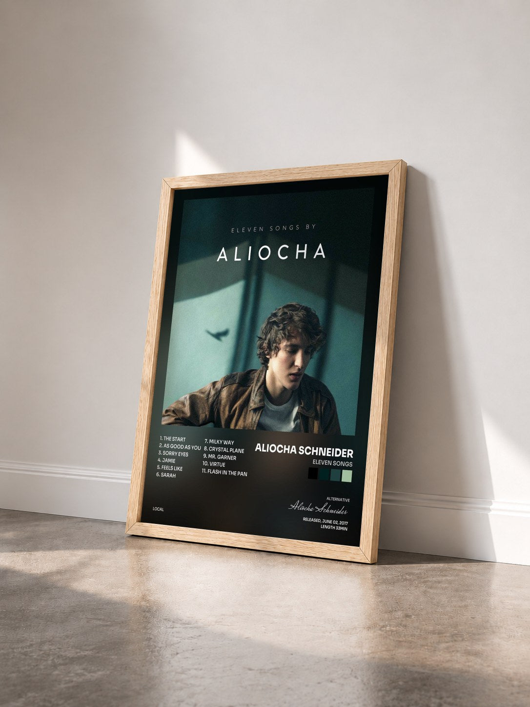 #bois Tableau de l'album Eleven Songs de Aliocha Schneider vu de trois quarts, cadre en bois brut