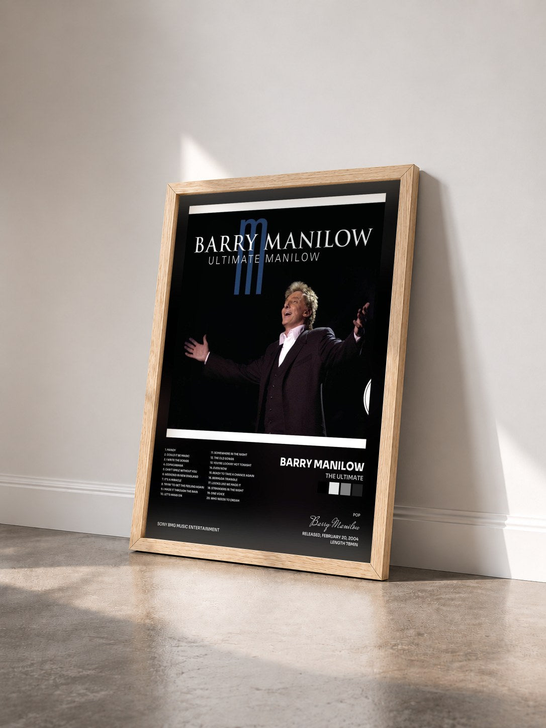 #bois Tableau de l'album The Ultimate de Barry Manilow vu de trois quarts, cadre en bois brut