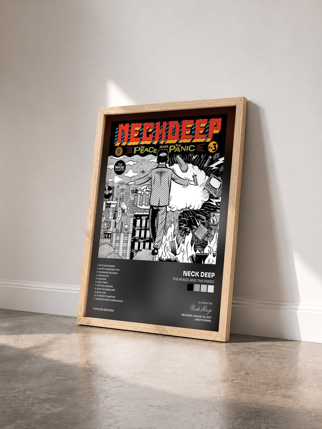 #bois Tableau de l'album The Peace And The Panic de Neck Deep vu de trois quarts, cadre en bois brut