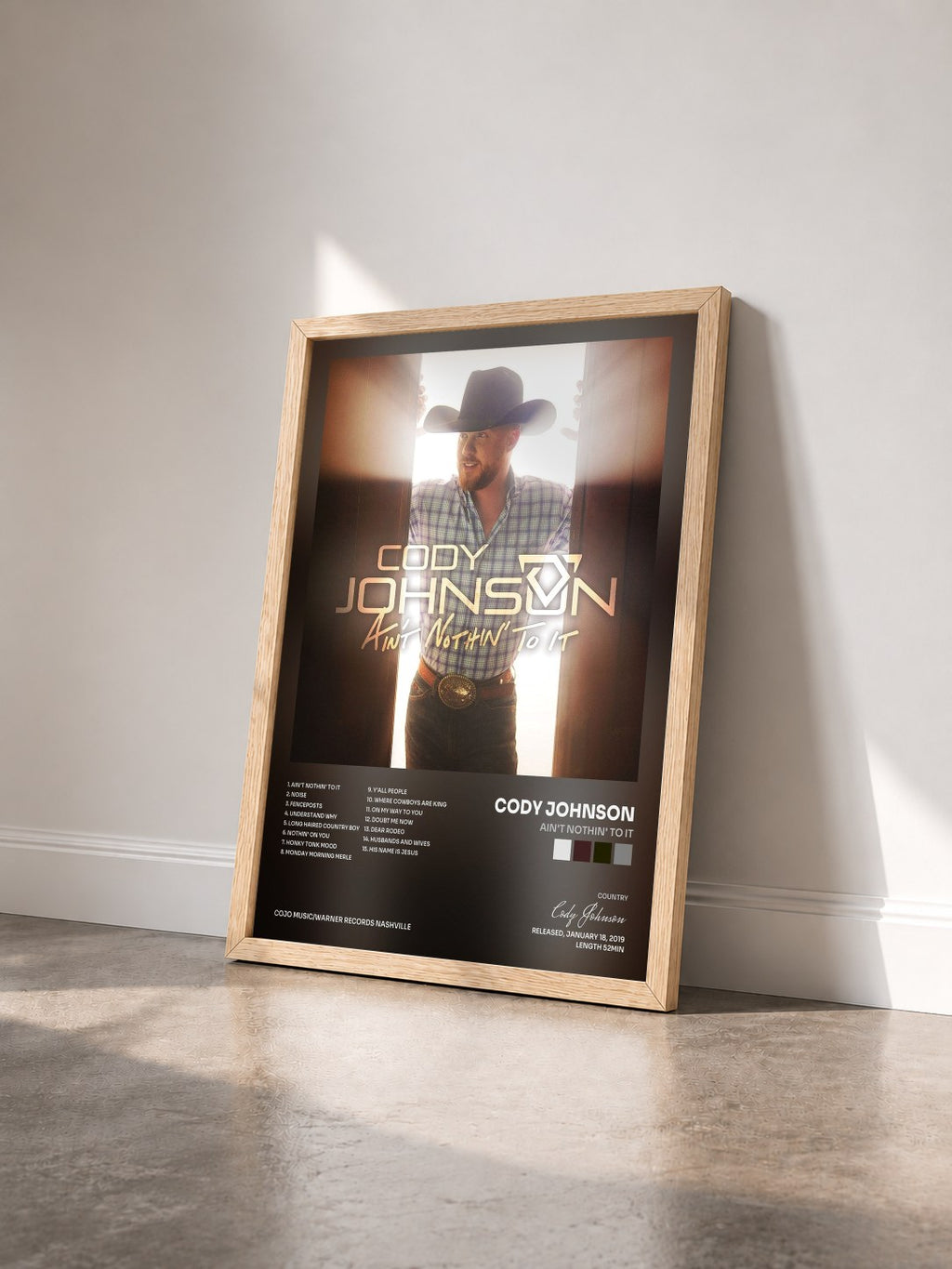 #bois Tableau de l'album Ain't Nothin' to It de Cody Johnson vu de trois quarts, cadre en bois brut