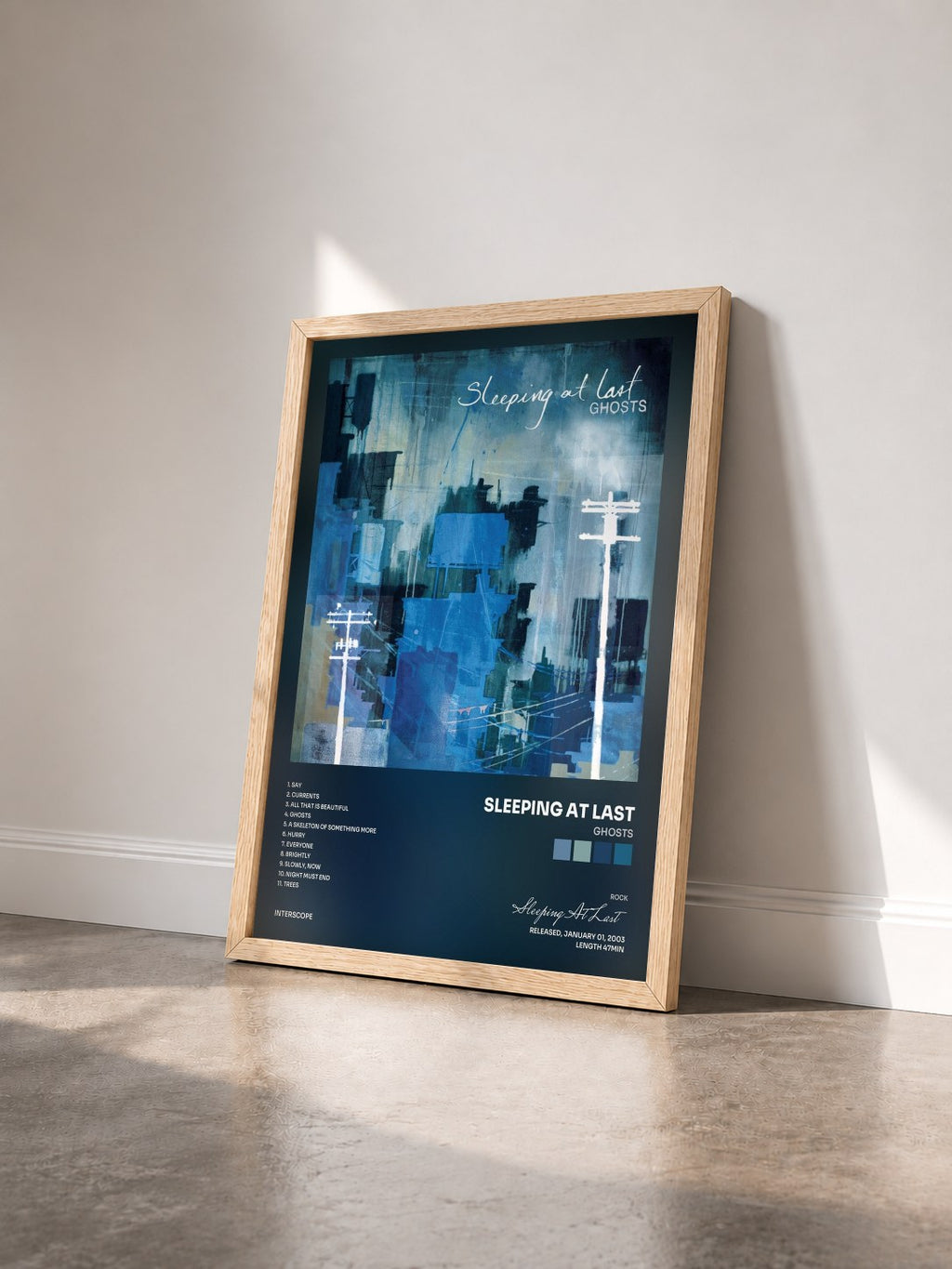 #bois Tableau de l'album Ghosts de Sleeping At Last vu de trois quarts, cadre en bois brut