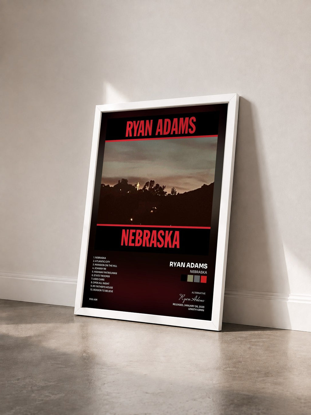 #blanc Tableau de l'album Nebraska de Ryan Adams vu de trois quarts, cadre blanc