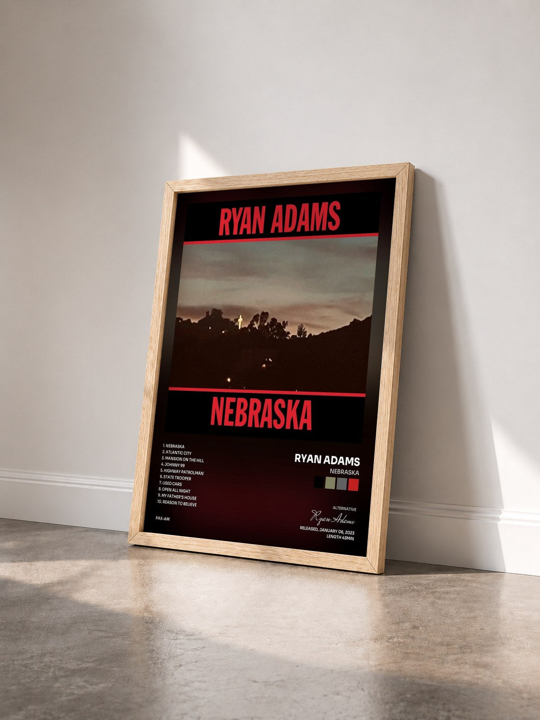 #bois Tableau de l'album Nebraska de Ryan Adams vu de trois quarts, cadre en bois brut