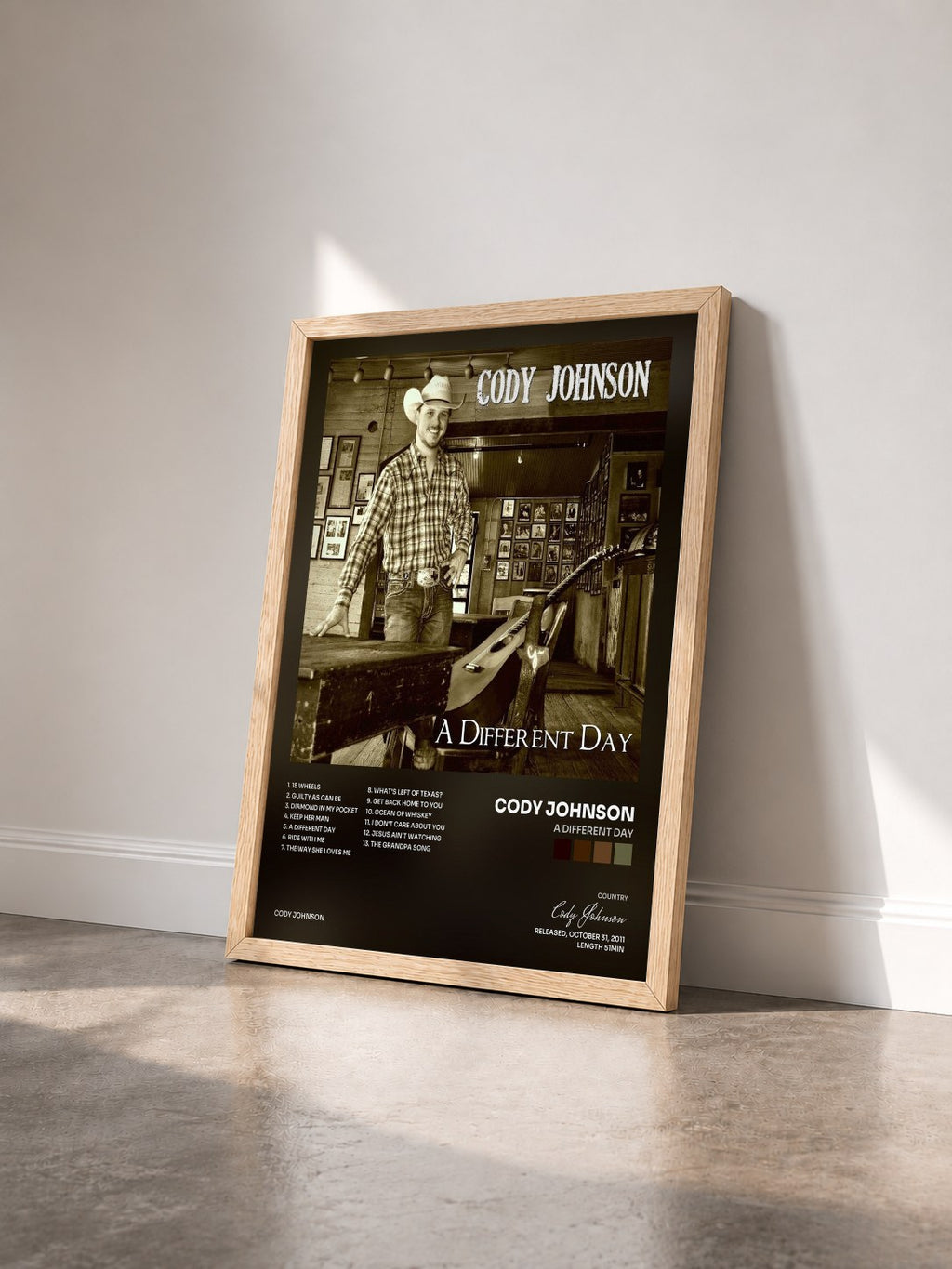 #bois Tableau de l'album A Different Day de Cody Johnson vu de trois quarts, cadre en bois brut