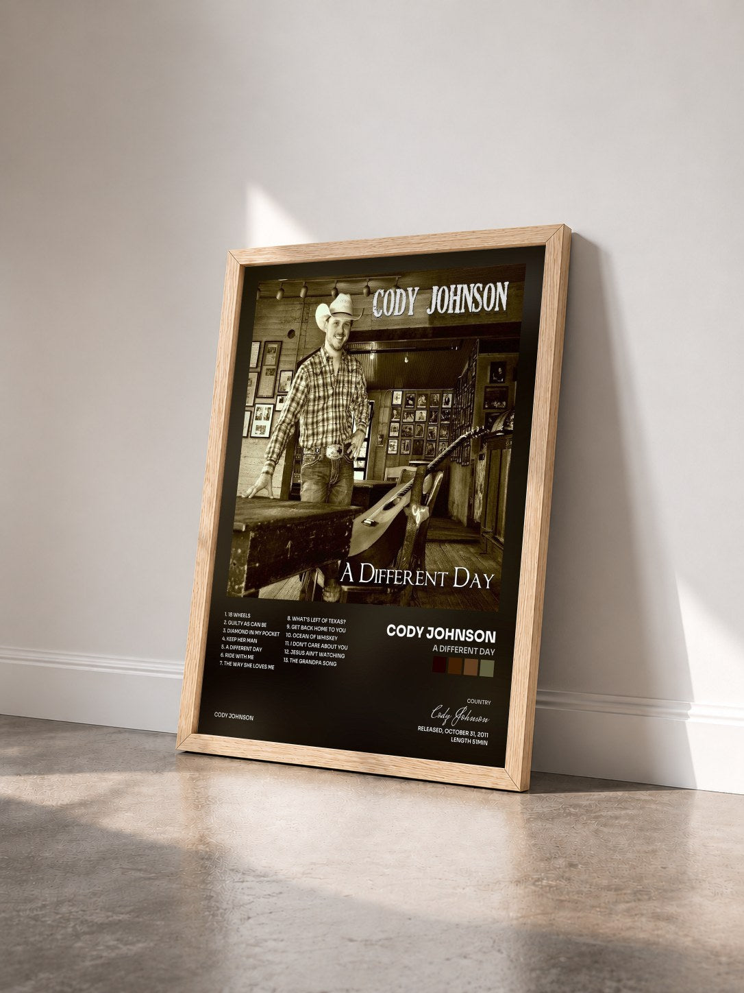 #bois Tableau de l'album A Different Day de Cody Johnson vu de trois quarts, cadre en bois brut
