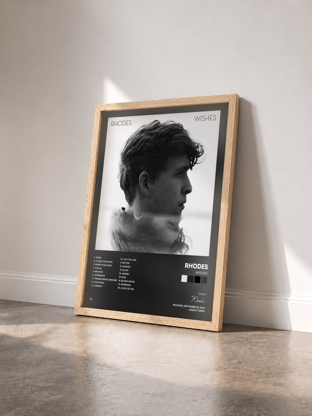 #bois Tableau de l'album Wishes de Rhodes vu de trois quarts, cadre en bois brut