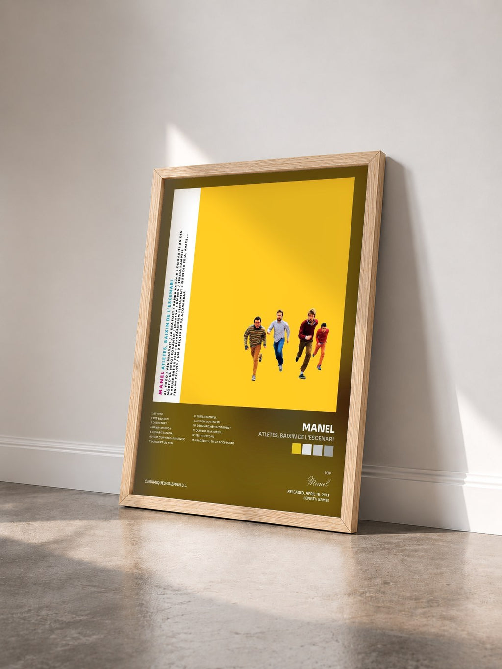 #bois Tableau de l'album Atletes, baixin de l'escenari de Manel vu de trois quarts, cadre en bois brut