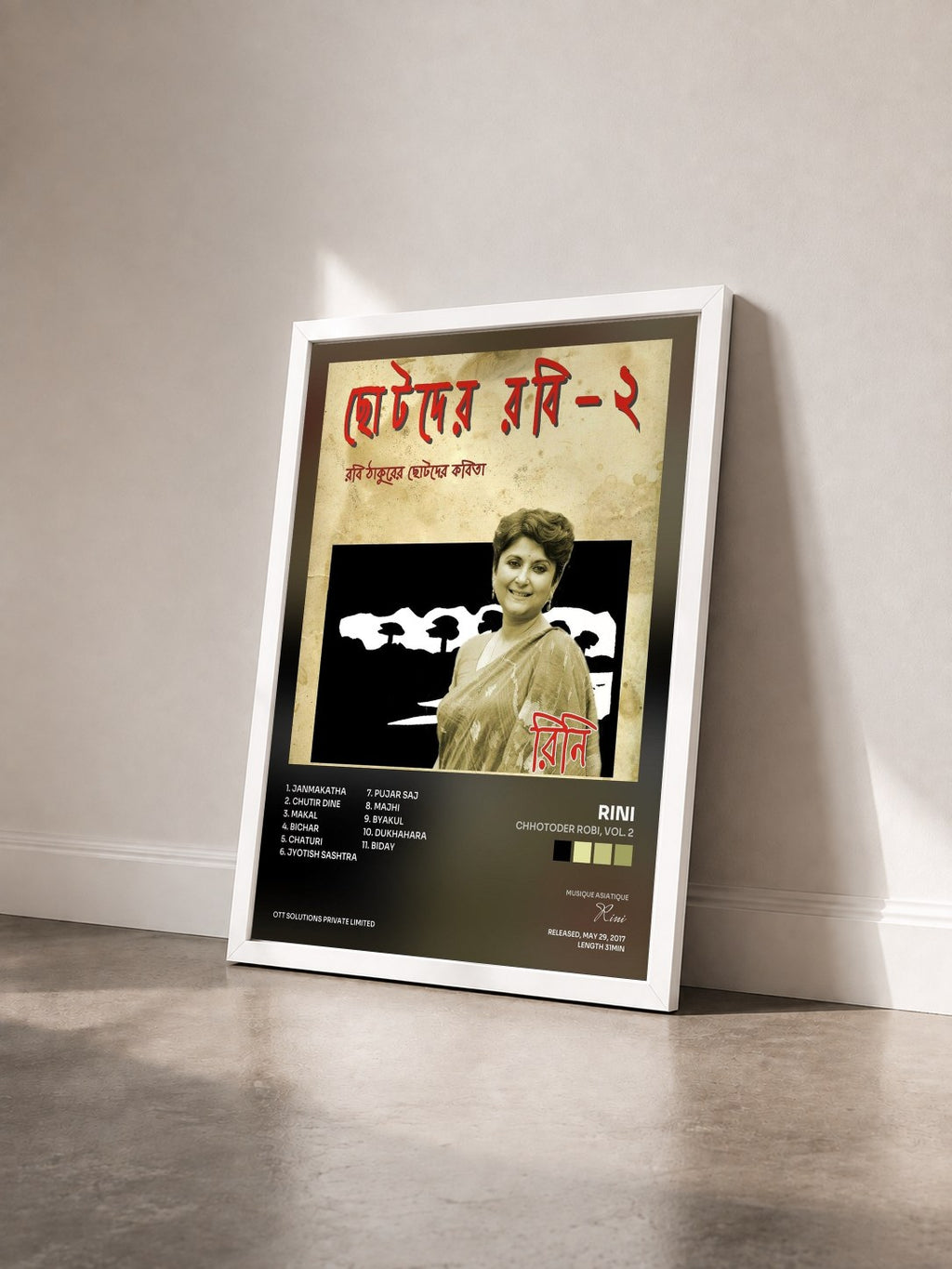#blanc Tableau de l'album Chhotoder Robi, Vol. 2 de Rini vu de trois quarts, cadre blanc