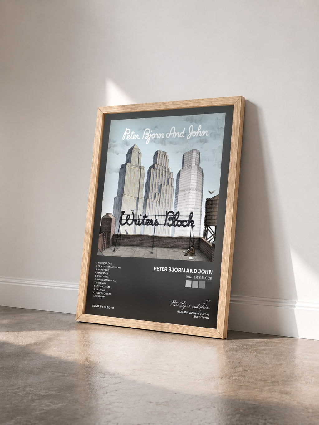 #bois Tableau de l'album Writer's Block de Peter Bjorn and John vu de trois quarts, cadre en bois brut