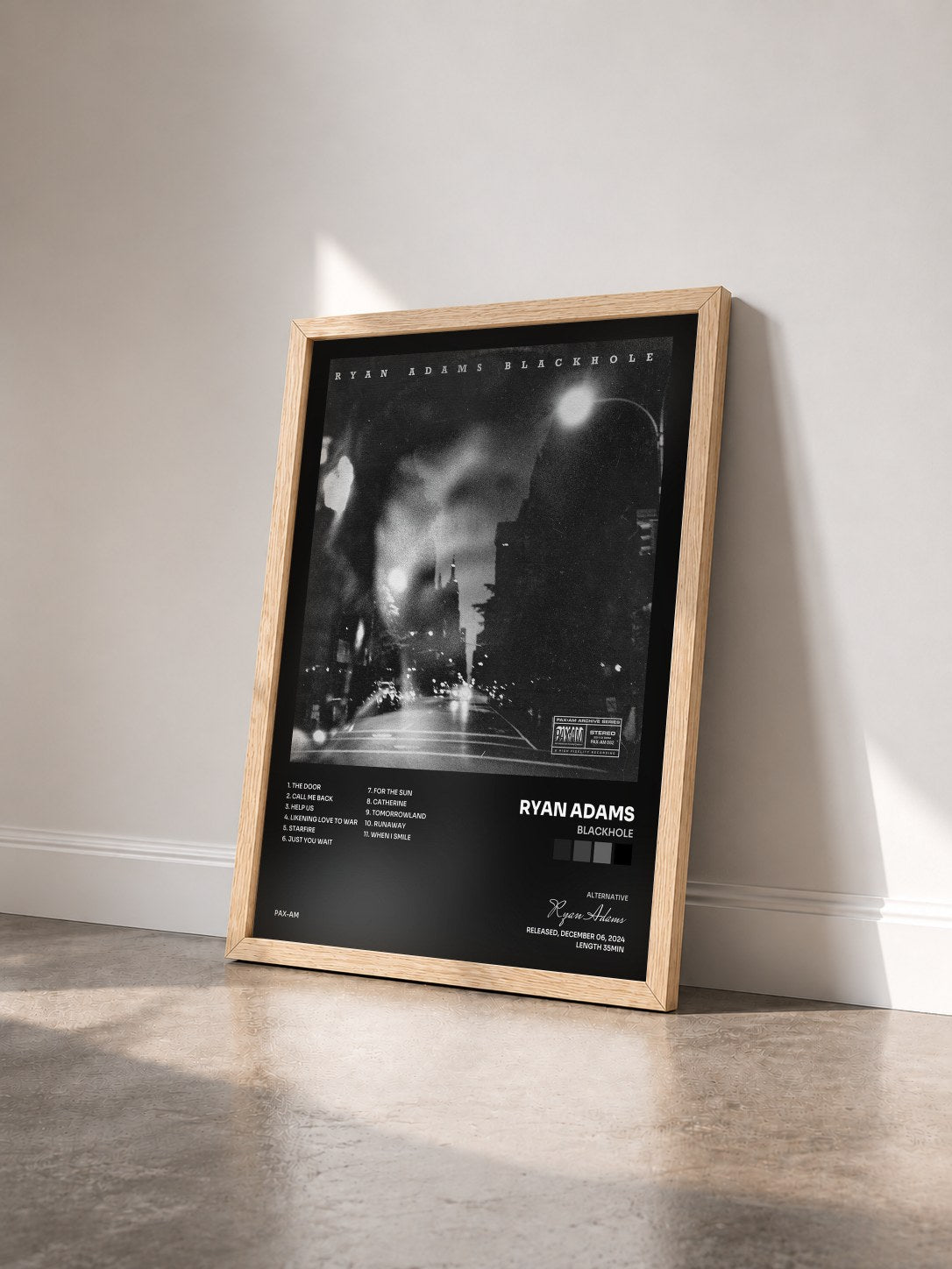 #bois Tableau de l'album BLACKHOLE de Ryan Adams vu de trois quarts, cadre en bois brut