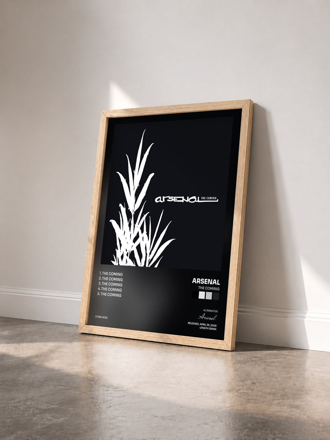 #bois Tableau de l'album The Coming de Arsenal vu de trois quarts, cadre en bois brut